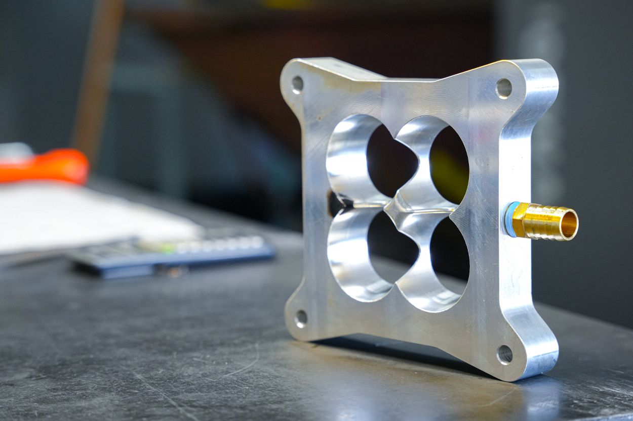 Custom carburetor spacer made on Hurco for Leo Stumpf’s Ford Ranchero project car