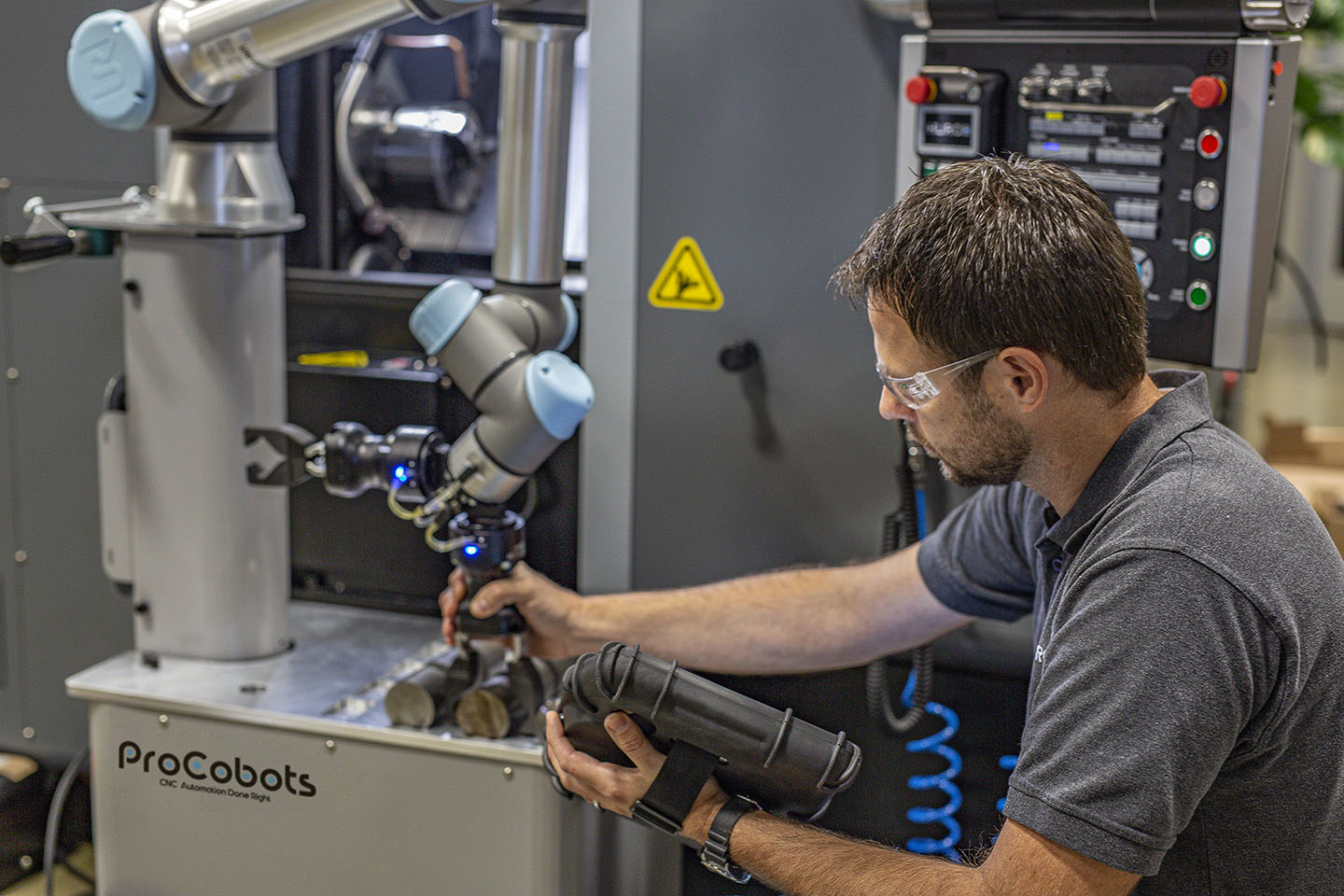 Machinist setting up ProCobot on Hurco Lathe